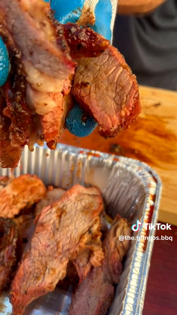 Real smoked tri-tip sliced to show the juicy pink center
